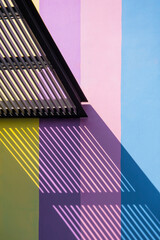 Sunlight and shadow of transparent awning on surface of pastel building wall in vertical frame for abstract architecture background and building exterior concept