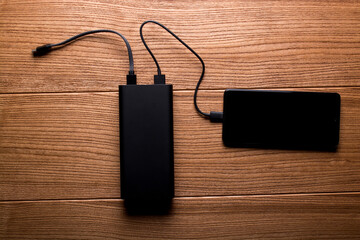 Power bank for charging mobile devices. Smartphone charger. External battery for mobile devices.