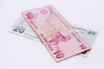 Ten turkish lira and twenty turkish lira paper currency laying isolated on the white