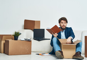 Business man boxes with new office things unpacking lifestyle