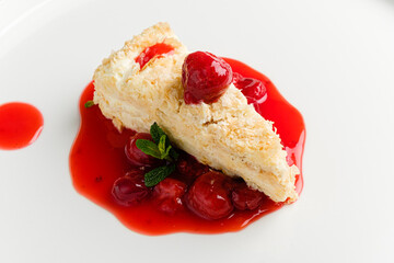 napoleon cake with cherry sauce and mint