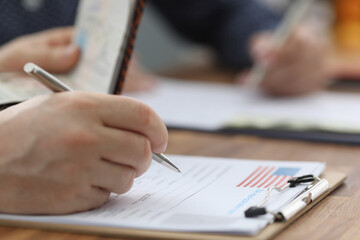 Man filling out documents for US visa closeup. Official travel abroad concept