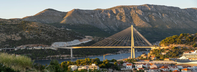 Panorama view of Dubrovnik bridge with mountain ranga Dalamatia coast in Croatia summer