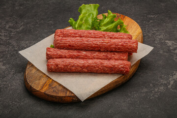 Raw beef sausages with spices