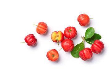 Flat lay of Acerola cherry with cut in half and leaves on white background.