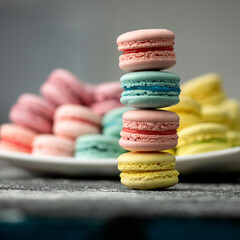 Multicolored Macaroon cookies or cakes tricky to tower. LGBT colors concept. Romantic Sweet gift or present for beloved person. Holiday or festive mood concept. Exquisite goodiesfor refined taste.