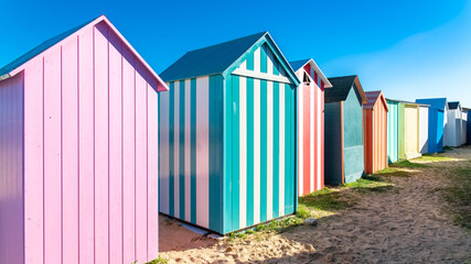 Naklejka premium Wooden beach cabins on the Oleron island in France, colorful huts 