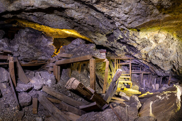 Square timber framing inside an old and abandoned gold mine in California. 