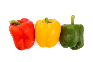Red , yellow and green bell pepper isolated on white background