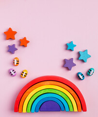 Eco-friendly colored wooden educational toys based on the Montessori method. Wooden rainbow, sorted by color. Copy space