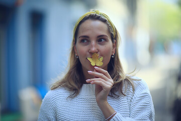 happy woman in autumn look, young girl outside in autumn mood