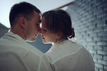 couple in love at home view from the back, man and woman relationship concept