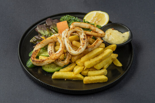 Salt and pepper squid with a fresh green salad.