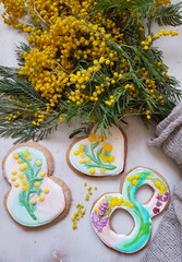 glazed gingerbread cookies and a bouquet of mimosa