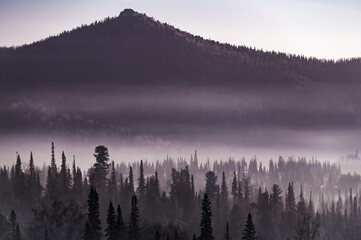 northern valley with hills in winter