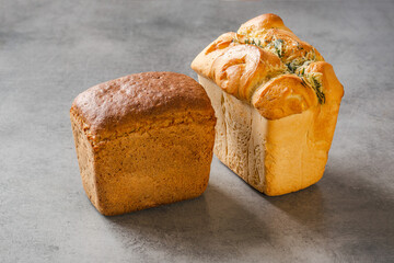 Freshly baked bread on the table, gray background and space