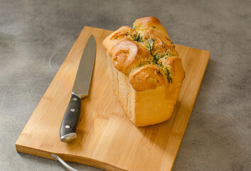 Freshly baked bread on the table, gray background and space