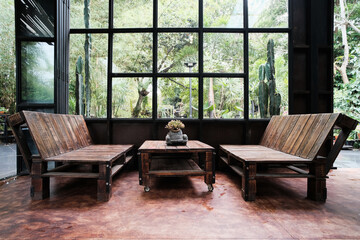 Wooden furniture in the living room Decorated with materials Vintage style with green forest garden background