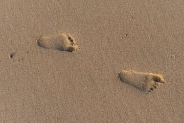 Baby footprints on the beach