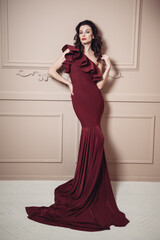 Mysterious Young beautiful stylish woman in evening dress, silhouette of a mermaid