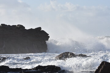 The sea demostrating its power against the cliffs