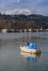 Fototapeta na wymiar Lone sailboat on the Willamette in Portland Oregon.