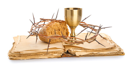 Holy Bible with chalice of wine, bread and crown of thorns on white background