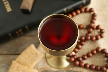 Chalice of wine on table, closeup