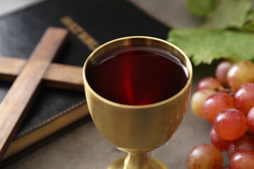 Chalice of wine on table, closeup