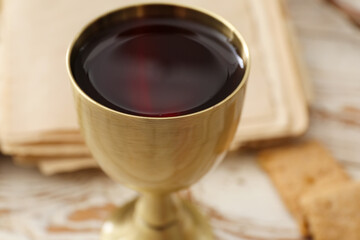 Chalice of wine on table, closeup