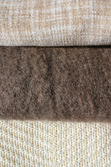 Fototapeta na wymiar Background from plaids of soft woolen fabrics.
