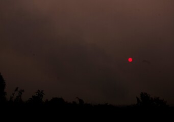 Red sun in smoke