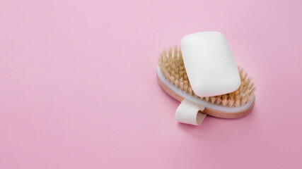 White soap bar on wooden brush. Body and beauty care concept. Web banner