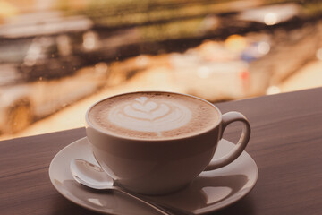 Cup hot coffee latte in in the morning coffee shop.