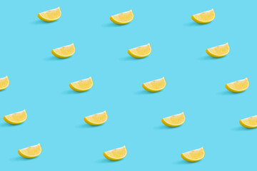 Creative summer fruit pattern made of lemon slice on pastel blue background