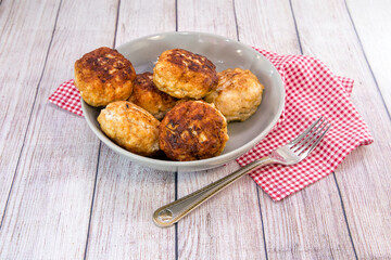 Several juicy fish cakes for a family dinner on the table