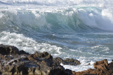 The sea demostrating its power against the cliffs