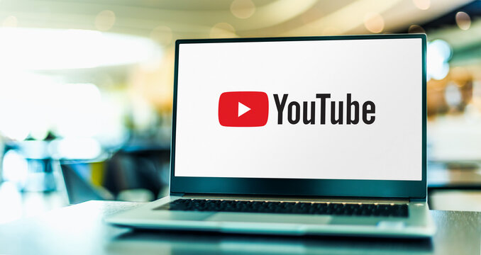 Laptop computer displaying logo of YouTube