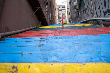 Fototapeta na wymiar colorful city stairs and buildings on two sides from low angle
