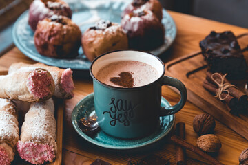 Cup of coffee on wooden table.