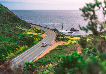 Single car on Pacific coastline road, view from Highway number 1, California