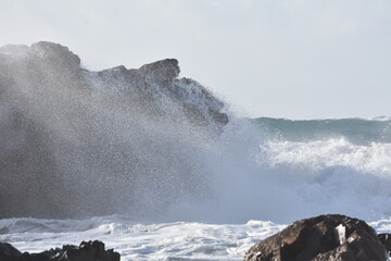 The sea demostrating its power against the cliffs