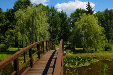 A small wooden bridge over a lake or river.