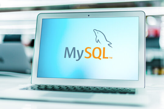 Laptop computer displaying logo of MySQL
