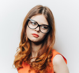 Obraz premium pretty woman in orange sundress and glasses makeup portrait