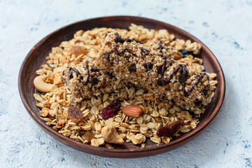 Healthy granola on a plate, and granola bars.