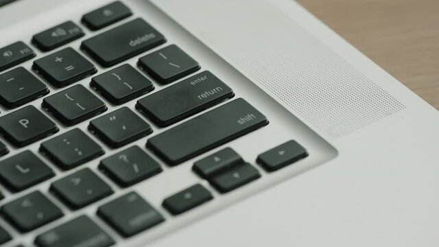 CRASH ZOOM IN Caucasian male pushing Enter button on a laptop keyboard. Fun, humorous style, comedic gesture