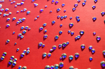 rhinestones on a red background, blure. design for text