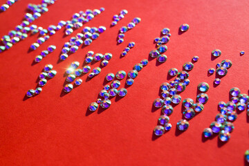 rhinestones on a red background, blure. design for text