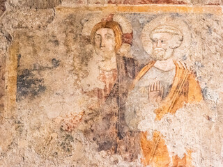 Fototapeta na wymiar Close-up on ruins of religious ancient roman fresco
